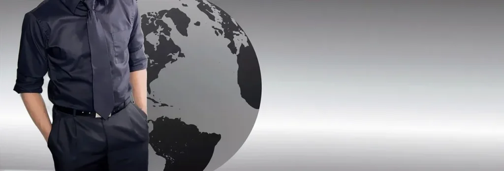A person in a black suit standing next to a stylized globe, representing global financial markets accessible through MyFastBroker.com.