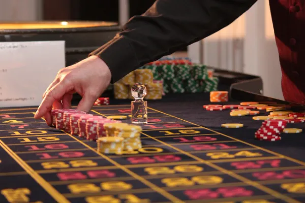 Roulette table with colorful chips placed on various numbers, representing the gameplay at GambleMax Casino.