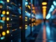 A long hallway of glowing server racks in a data center, symbolizing secure cloud storage infrastructure.
