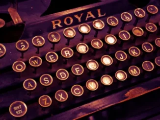 Close-up of a vintage Royal typewriter keyboard with keys "A" through "Z" visible, highlighting the letter "X."