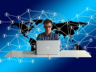 Illustration of a man working on a laptop, superimposed over a connected social network overlay on a world map, symbolizing the viral spread and digital communication of a trend across the USA.