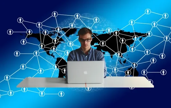 Global Reach: The Tentonraten Trend Goes Digital in the USA Illustration of a man working on a laptop, superimposed over a connected social network overlay on a world map, symbolizing the viral spread and digital communication of a trend across the USA.